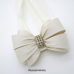 "IVORY BOW HEADBAND --->> COLORS AVAILABLE <<-- Please click here: https://www.etsy.com/shop/BySophiaBaby?ref=seller-platform-mcnav&search_query=1486 -->> FREE SHIPPING!! <<-- *BOW HEADBAND DESCRIPTION*: - Unique Handcraft Double Bow Embellished with high quality Rhinestones placed on a 2\" stretchy Headband. - Bow is made of Fabric and Rhinestones, the bow size it's approximately 3.75\"x2.75\" - This Headband is perfect for any occasion, Weddings, Flower Girls or jus Adjustable Cream Hair Accessories With Bow, Cream Headband For Baptism, White Matching Headband For Baptism, Cream Baptism Headband Hair Accessory, Cream Hair Accessories With Matching Headband For Baptism, White Hair Accessories With Matching Headband For Baptism, White Bow Headband For Wedding, Elegant White Headband For First Communion, Elegant White Headband With Ribbon