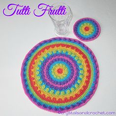 a crocheted placemat and coaster set with the words, tati frut on it