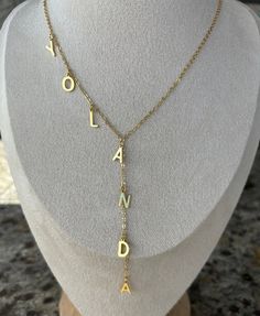 ITEM DETAILS: Handmade Dainty 18k Plated Gold chain with letters. You can personalize it with your initials, your name, kids name or any other word. to wear it for everyday! MATERIALS: ~Chain :18K Plated Gold ~Letter: 18K gold plated SIZE: ~Chain wide: 1.6mm ~Chain length: 15"- 16" and 18" ~Letters Height: 12 mm Wide: depending on the letter you chose but is 10mm Approx SHIPPING & DELIVERY: (Estimated) ~ Domestic (U.S.) Standard: 2 - 5 business days ~Domestic (U.S.) Priority: 1 - 3 days FOLLOW US: https://instagram.com/lourdes_jewelry_ https://https://www.facebook.com/LourdesDJewelry Thank you so much for visiting and hope you enjoy shopping with us Custom Initial Pendant Necklace With Name, Initial Pendant Name Necklace With Adjustable Chain, Gold Initial Pendant Necklace With Custom Name, Custom Name Initial Pendant Necklace In Gold, Gold Initial Necklace With Custom Name, Personalized Initial Pendant Name Necklace With Adjustable Chain, Custom Name Initial Necklace For Personalized Gift, Adjustable Gold Name Necklace, Personalized Gold Lariat Jewelry