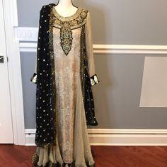 Beautiful Ready Made 2 Piece Gown Style Pakistani Outfit. This Dress Come With A Scarf/Dupatta To Style With. Size M. Please Contact Do Measurements And Questions. Open To Reasonable Offers. *Outfit Has Some Thread Pulling. Semi-stitched Evening Dress With Sheer Dupatta, Fitted Beige Anarkali Set With Dupatta, Formal Unstitched Floor-length Dress, Semi-stitched Long Formal Dresses, Fitted Gold Dress With Dabka Detailing, Anarkali Evening Dress, Beige Floor-length Gown With Sheer Dupatta, Elegant Long Dupatta For Party, Evening Dabka Dress For Festive Occasions