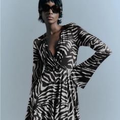 Dress With Crossover V-Neckline And Flared Long Sleeves. Contrasting Inner Lining. Side Hidden In-Seam Zip Closure. Brand New With Tags. Armpit To Armpit 18” Length 31” V-neck Zebra Print Party Dress, Black Zebra Print V-neck Dress, Black Zebra Print Dress For Night Out, Black Zebra Print Maxi Dress, Zebra Print V-neck Party Dress, Spring Zebra Print Midi Dress, Chic Zebra Print Mini Dress, Chic Black Mini Dress With Zebra Print, Spring Midi Dress In Zebra Print