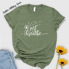 "Just Breathe Shirt For Women, Spring Fitness Spiritual Shirt, Meditation Gift,Yoga Lover Gift Shirt,Dandelion Shirt,Summer Meditation Tshirt T-Shirts aren't just casual wear. They reflect our personalities, interests and identities. As 'BLG Design Lab', we aim to bring 'living' shirts together with you. Using premium quality materials, we design to help you look stylish and feel your best. Please look over the product images, select your style and enjoy it every day. HOW TO ORDER: 1-) Please look into all photos of our product 2-) Select your product Specify its style, color, and size 3-) If necessary, enter your Text/Design In The Personalization Box 4-) Click add to cart. You can go back and follow the same steps to add more items to your cart 5-) Click \"Proceed to check out\" 6-) Chec Spring Casual Yoga T-shirt, Inspirational Cotton Tops For Summer, Inspirational Cotton Summer Tops, Graphic Print Yoga Top For Summer, White T-shirt For Yoga In Summer, White T-shirt For Yoga And Summer, White Summer Yoga T-shirt, Inspirational Graphic Print Tops For Summer, Summer Yoga T-shirt With Crew Neck