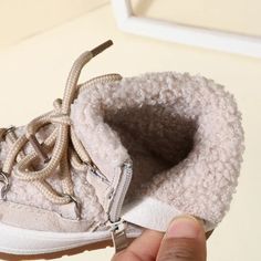 These Wool Laced Winter Rubber Sneakers will keep your little ones' feet warm and cozy all winter long! Made from lightweight rubber and lined with wool, these sneakers provide the perfect blend of comfort and style for any season. Stay one step ahead of the cold with these winter-ready shoes. Warm Winter Booties With Round Toe, Winter Booties With Plush Lining And Round Toe, Winter Sneakers With Rubber Sole And Round Toe, Winter Outdoor Booties With Round Toe, Casual Winter Booties With Plush Lining, Winter Sneakers With Round Toe, Casual Warm Booties With Round Toe, Outdoor High-top Sneakers With Elastic Laces, Outdoor High-top Sneakers With Elastic Laces And Round Toe