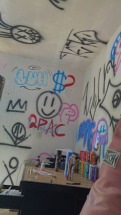 a room with graffiti all over the walls