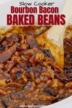 slow cooker bourbon bacon baked beans in a white bowl with wooden spoon and text overlay