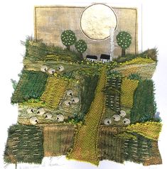 an image of a patchwork quilt with sheep and trees in the field on it