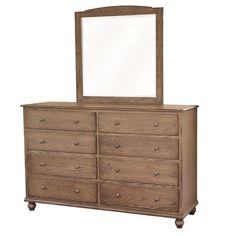 a dresser with a mirror on top of it and wooden drawers below the drawer,