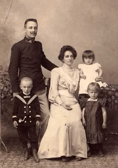 an old black and white photo of a family