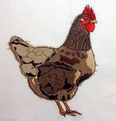 a close up of a chicken on a white cloth with brown and red trimmings