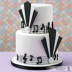 a white and black cake with musical notes on it