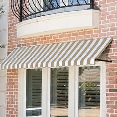 an awning on the outside of a brick building