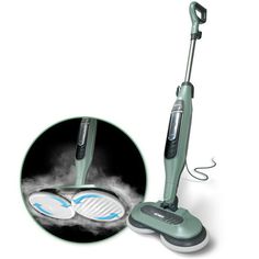 an electric steam mop is shown with its wheels on the floor and in front of it