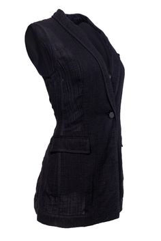 This unique blazer vest is the perfect statement layer for anyone who likes to make an entrance! Made with a breathable fabric, this sleeveless piece is inspired by classic tuxedos, making a modern update on a tried and true classic. Wear this with some high-waisted trousers and a sleeveless button down for menswear inspired party look. Size S 100% Cotton Tuxedo style vest Front button closure Shawl lapel Faux front pockets Waist 36" Total length 29.5" Classic Black Summer Vest, Black Notch Lapel Vest For Fall, Sleeveless Black Business Blazer, Sleeveless Black Blazer For Business, Fitted Vest For Workwear In Spring, Fitted Vest For Spring Workwear, Fitted Sleeveless Spring Blazer, Classic Fitted Blazer For Layering, Classic Fitted Vest For Layering