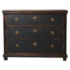 an antique chest of drawers with brass knobs on the top and bottom, against a white background