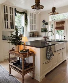 a kitchen filled with lots of counter top space next to a stove top oven and sink