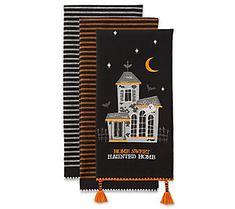 three halloween themed napkins with an image of a house