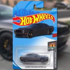 the hot wheels car is on display in front of a blurry background