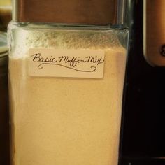 a container filled with white powder sitting on top of a counter next to an oven