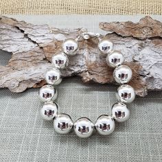 "Beautiful! 🛑 BEFORE CHOOSING YOUR LENGTH/SIZE PLEASE READ **ENTIRE** DESCRIPTION 🛑                               These VERY LARGE beads affect INSIDE circumference (what your wrist measures with a string/ribbon/measuring tape) which affects OUTSIDE circumference.  VERY large, shiny 14mm round ball sterling silver bead bracelet.                                                          🚩 🚩 🚩  IMPORTANT  IMPORTANT  THE BIGGER THE BEADS, THE MORE LENGTH REQUIRED for a good fit. EXAMPLE:  If yo Sterling Silver Bracelet With 8mm Beads, Silver Beaded Bracelets With Polished Beads, Sterling Silver Bracelets With Ball Chain And Round Beads, Sterling Silver Bracelets With Ball Chain, Sterling Silver Bracelet With Spacer Beads, Silver Bracelets With Large Beads For Gift, Silver Beaded Bracelet With Ball Chain As Gift, Silver Bracelets With Spacer Beads, Silver Beaded Bracelets With Ball Chain