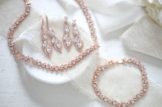 "Our rose gold wedding necklace set is perfect for the bride or as a gift for the bridesmaids. Dainty but so full of sparkle ! - Crafted with Swarovski Pure Brilliance components. - All clear stones - Rhodium, yellow gold or rose gold finish - Earrings with hook measure 2\" - Earrings with post measure 1.5\" - Necklace measures 16.5 inches ( happy to customize the length if needed) - Bracelets measures 6.5 inches ( happy to customize the length if needed) - Nickel free and hypoallergenic - PLEAS Needed Bracelets, Flower Girl Jewelry Set, Fall Wedding Jewelry, Blue Bridal Earrings, Gold Necklace Wedding, Rose Gold Wedding Jewelry, Wedding Necklace Set, Gold Earrings Wedding, Wedding Jewelry Set