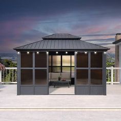 a gazebo sitting on top of a cement patio