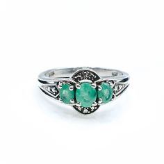 Sterling Silver Natural Emerald Three Stone Ring Size 5. This Platinum plated Sterling Silver ring features three oval cut natural green Emeralds in a three stone design. Complete with comfort fit bottom, this ring will make a special gift. Emeralds symbolize love and truth and they are also the May Birthstone.  Ring is pre-owned and in great condition. Buy with confidence knowing that all our jewelry items are exactly as described. All precious metals are tested and are guaranteed with the Ther Silver Emerald Ring With Three Stones, Oval Shape, Green Three Stone Ring Jewelry, Oval Three-stone Emerald Ring Fine Jewelry, Oval Emerald Three Stone Fine Jewelry Ring, Oval Three Stone Emerald Ring Fine Jewelry, Green Emerald Three Stone Ring For Anniversary, Green Three-stone Emerald Ring For Anniversary, Green Three Stone Emerald Ring For Anniversary, Green Three Stone Emerald Promise Ring