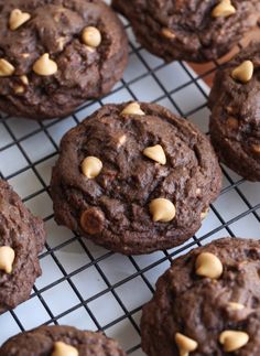 chocolate cookies with peanut butter chips on a cooling rack, ready to be baked or eaten