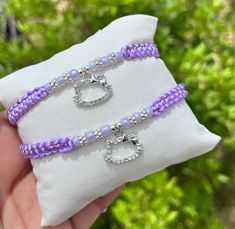 Comes as pictured  Bracelet are adjustable in size Adjustable Charms Friendship Bracelets, Adjustable Friendship Bracelets With Charms, Cute Adjustable Silver Friendship Bracelets, Cute Adjustable Purple Friendship Bracelets, Adjustable Braided Bracelet With Charms For Gift, Adjustable Pink Heart Bracelet With Charm, Adjustable Purple Bracelets With Charms, Pink Heart-shaped Braided Bracelet Gift, Hello Kitty Crystal Bracelet