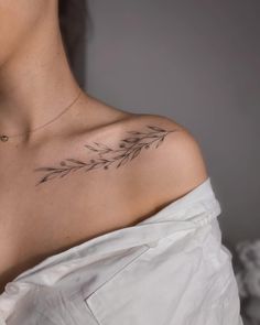 a woman with a tattoo on her shoulder