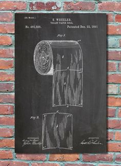 a chalkboard drawing of a roll of toilet paper on a brick wall next to a blackboard