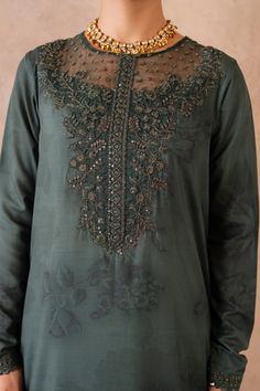 Shirt: Printed Raw SilkNeckline: Embroidered OrganzaFront, Back, Chalk & Sleeves Lace: Embroidered Organza (5.75 M)Dupatta: Embroidered Organza(2.5 M)Pallu Lace: Embroidered Organza(2.5 M)Trouser: Dyed Raw Silk (2.5 M) Green Straight Kurta Sets With Embroidered Neckline, Festive Green Kurta With Embroidered Neckline, Traditional Long Sleeve Set With Embroidered Neckline, Festive Eid Top With Embroidered Neckline, Traditional Straight Kurta Top With Embroidery, Green Kurta With Embroidered Neckline For Eid, Elegant Tops With Embroidered Neckline For Eid, Elegant Embroidered Neckline Tops For Eid, Festive Designer Embroidered Neckline Top