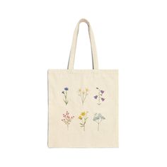 This 100% cotton bag comes in one size - 15" x 16"- perfect for everyday wear. This well made tote is durable and will last for years. The bag features 20" handles (made from the same canvas), making it easy to carry even with a week's worth of shopping. .: 100% cotton canvas .: Heavy fabric (12 oz/yd² (406.9 g/m .: Sewn-in label .: Available in natural color Flower Tote Bag, Flower Tote, Flowers Tote, Flower Bag, Color Care, Cotton Tote Bag, Canvas Tote Bag, Cute Bag, Cotton Totes