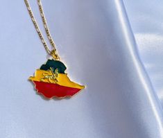 The 18k Gold Plated Ethiopian Map and Flag Necklace is 4.4cm x 4.4cm the length of the chain is 50cm / 20in Ethiopian Flag, Map Necklace, The Chain, Ethiopia, New Product, Necklace Etsy, Arrow Necklace, 18k Gold, Gold Plate