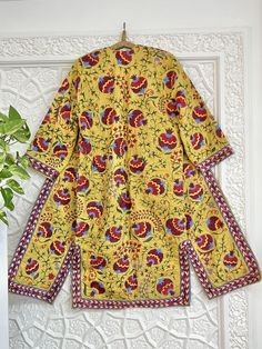 Uzbek hand embroidery suzani robe, chapan, coat. * Measurements: length - 125 cm, chest round - 120 cm, hips round - 120 cm, sleeve - 48 cm, sleeves round - 44 cm * Coat with ikat inside lining "Suzani" means needlework, but to most collectors, the word has a more specific meaning: "suzani" is synonymous with the glorious embroideries of Uzbekistan, in Central Asia. In recent years, we've witnessed a remarkable revival of this old traditional art form. These textiles are pretty complex, which indicates their importance. In fact, suzanis were part of a bride's dowry, generally started at the birth of a daughter and continued with the help of family and friends until the bride's dowry was complete and ready to be presented to the groom at the wedding. It was a symbol of the family's status, Kurta With Printed Motifs And Kimono Sleeves, Traditional Kurta With Multicolor Floral Embroidery, Traditional Multicolor Embroidered Kurta With Floral Print, Traditional Kurta With Multicolor Embroidery And Floral Print, Festive Long Sleeve Kaftan With Printed Motifs, Festive Long Sleeve Printed Kaftan, Traditional Printed Motifs Kaftan Tunic, Traditional Tunic Kaftan With Printed Motifs, Traditional Kurta With Floral Print And Kimono Sleeves