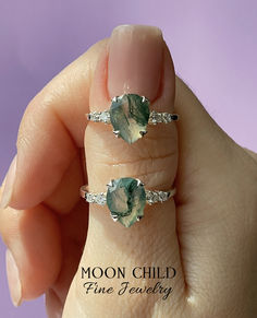 Elevate your look with the "Fern" ring, featuring a captivating Moss Agate gemstone and sparkling White Topaz. The Moss Agate, with its intricate moss-like inclusions, evokes the serenity of a forest glade, while the White Topaz adds a touch of sparkle reminiscent of morning dewdrops. This ring is a wearable work of art, capturing the enduring beauty of nature. Nature-inspired Gemstone Rings For May Birthstone, Nature-inspired Rings With May Birthstone Gemstone, Nature-inspired Rings With May Birthstone, Mystical Green Gemstone Jewelry, Adjustable Moss Agate Gemstone Jewelry, Moss Agate Ring With Natural Stones, Nature-inspired Diamond Gemstone Jewelry, Nature-inspired Agate Rings With Natural Inclusions, Elegant Moss Agate Ring With Natural Stones