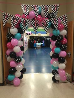 an entrance decorated with balloons and streamers