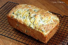 a loaf of bread sitting on top of a cooling rack