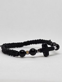 Handmade Cord Bracelet with Cross. Made with PU Waxed Cord. With Natural Obsidian Stone Beads 8mm/0,31in Hematite beads. Adjustable size 18-22cm/7-8,6in. Adjustable Rosary Bracelet With Polished Beads, Adjustable Onyx Beaded Bracelets With Polished Beads, Adjustable Onyx Stretch Bracelet Gift, Handmade Adjustable Onyx Beads, Adjustable Beaded Cross Rosary Bracelet, Adjustable Black Beads Rosary Bracelet As A Gift, Adjustable Black Beads Rosary Bracelet For Gift, Adjustable Rosary Bracelet With Black Beads For Gift, Adjustable Onyx Beaded Bracelets For Spiritual Style