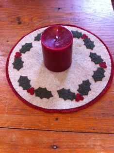 a candle is sitting on top of a placemat