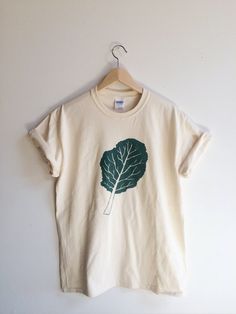 Kale Screen Printed T Shirt, Kale Shirt Food T-shirt, Food Graphic Tee, Organic Cotton Crew Neck T-shirt, Eco-friendly Green Cotton T-shirt, Organic Short Sleeve T-shirt With Screen Print, Organic Cotton Crew Neck Tops, Hand Printed Organic Cotton T-shirt, Hand-printed Organic Cotton Crew Neck T-shirt, Organic Cotton Hand Printed Crew Neck T-shirt