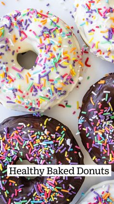 several donuts with different colored sprinkles on them