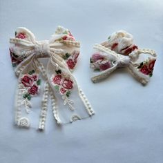 Embroidered Ivory Rose Floral Hair bows are the perfect accessory for Kids to Adults! It's a great accessory to help fancy your hair up!  Comes on a Barrette and the size is 3.25"! Bow measurement: Medium Bow: 5" by 8" Big Bow: 7" by 9" Scrunchie Bow- 5" wide x 2.5" long  Please don't leave your child unattended with the bows. Colors may look different in person than on the computer screen! They also might be a different fabric lot than what is pictured! Fabric dye lots can be off a little even if it's the same fabric. Pictures of girls wearing bows are also edited so it may not look exactly like that color!  For Sneak Peaks at NEW items coming: Follow us on Instagram @enchantingtigerlily Facebook Group https://www.facebook.com/groups/enchantingtigerlilyvip Scrunchie Bow, Fabric Dye, Fabric Pictures, Trendy Hair, Bridal Shower Gift, Big Bow, Don't Leave, Women's Hair, Big Bows