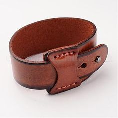 a brown leather belt with two holes on the side and one hole in the middle