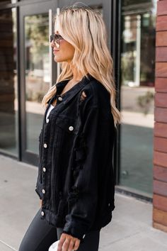 This cute black oversized jean jacket is perfect for any chilly night out this season. We are loving the distressing throughout and light wash style. We also love the relaxed fit, pockets, and frayed hem. It will be a must have in your closet for every season. Pair this jacket with a tank dress or wear it over a bodysuit and a skirt! Oversized fit in bust 100% cotton Fabric has no stretch Unlined Size small from shoulder to hem: 25.5" Hand wash cold, line dry Patterns may vary Materials may have White Bra Top, Oversized Distressed Denim Jacket, Must Have In Your Closet, High Waisted Black Leggings, Oversized Jean Jacket, Oversized Jeans, White Bras, Distressed Denim Jacket, Black High Waist