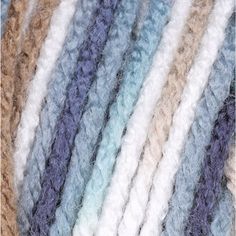 multicolored crochet yarn with white, blue, and brown stripes on it