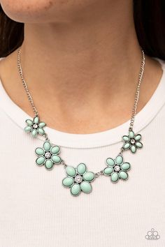 Dotted with dainty white rhinestone centers, a flirtatious assortment of pastel green beaded flowers gradually increase in size as they link below the collar for a playful pop of color. Features an adjustable clasp closure.   Sold as one individual necklace. Includes one pair of matching earrings.   4/18/22 Happy Jewelry, Bling Necklace, Party Necklace, Paparazzi Accessories, White Rhinestone, Green Item, Green Necklace, Paparazzi Jewelry, Pastel Green