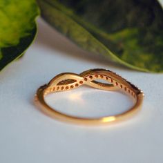 "Crafted in 14k solid gold, this simple ring has gorgeous curves in the right places ;) Shaped like infinity for your infinite love and respect for the receiver! * Diamond Wt. : 0.20 Cts (approx) * Color-Clarity Grade : H-I, Vs-Si * Gold - 14kt, 1.5 gms solid yellow gold (approx) If you like this ring, please press \"Pin it\" button on the right of your screen. Find us on Instagram for exquisite designs: @abhikajewels Like us on Facebook: www.facebook.com/Abhikajewels Thank you for visiting our Modern Twist Infinity Stackable Rings As Gift, Infinity Shape Stackable Fine Jewelry Rings As Gift, Infinity Shaped 14k Gold Diamond Ring Gift, Fine Jewelry Infinity Stackable Rings As Gift, Fine Jewelry Stackable Infinity Rings As Gift, 14k Gold Infinity Diamond Ring Gift, Infinity Half Eternity Rings As Gifts, 14k Gold Infinity Stackable Promise Rings, Promise Stackable Infinity Rings In 14k Gold