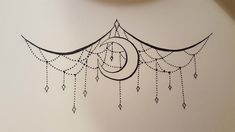 a drawing of a crescent with beads hanging from it's sides and a clock on the wall behind it