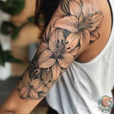 a woman with a flower tattoo on her arm