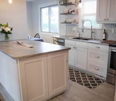 the kitchen is clean and ready for us to use in its new owner's home